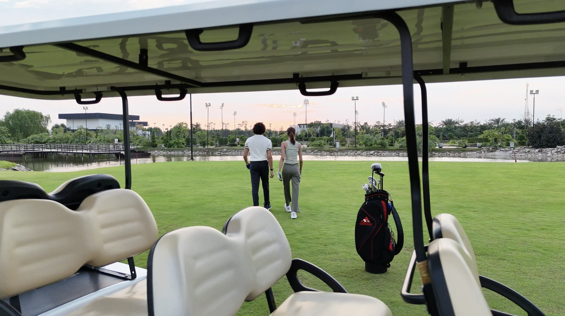 Golfers and golf cart at Naturals